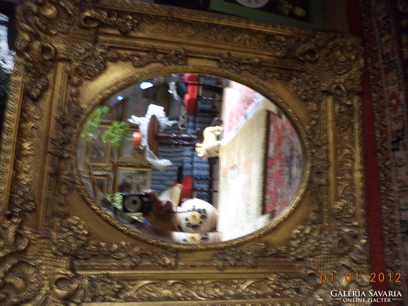 Csiszolt tükör,barokk keretben.