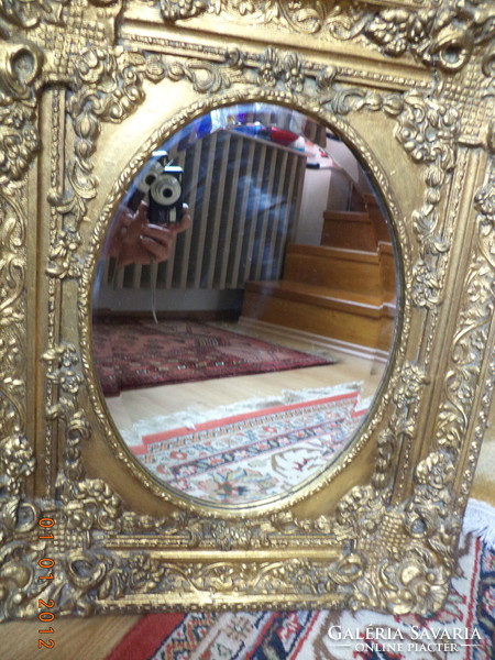 Polished mirror, in a baroque frame.