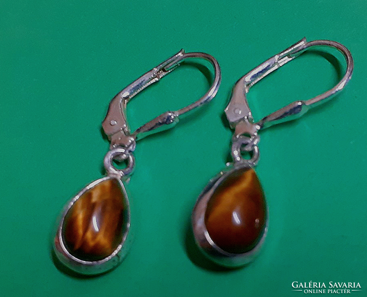 In good condition marked sterling silver hook-and-loop earrings studded with tiger eye stones with a secure switch