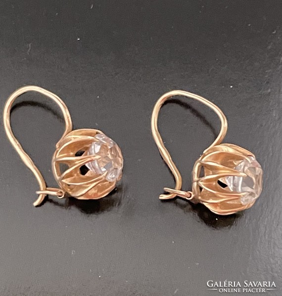 Gold earrings with white topaz stones