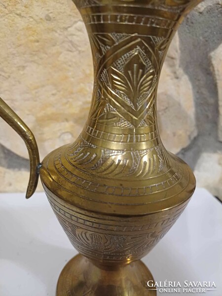Copper spout with engraved pattern