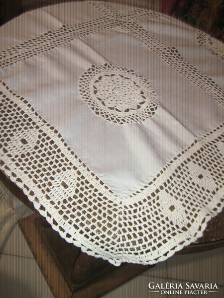 Elegant tablecloth with a beautiful hand-crocheted edge and crochet insert