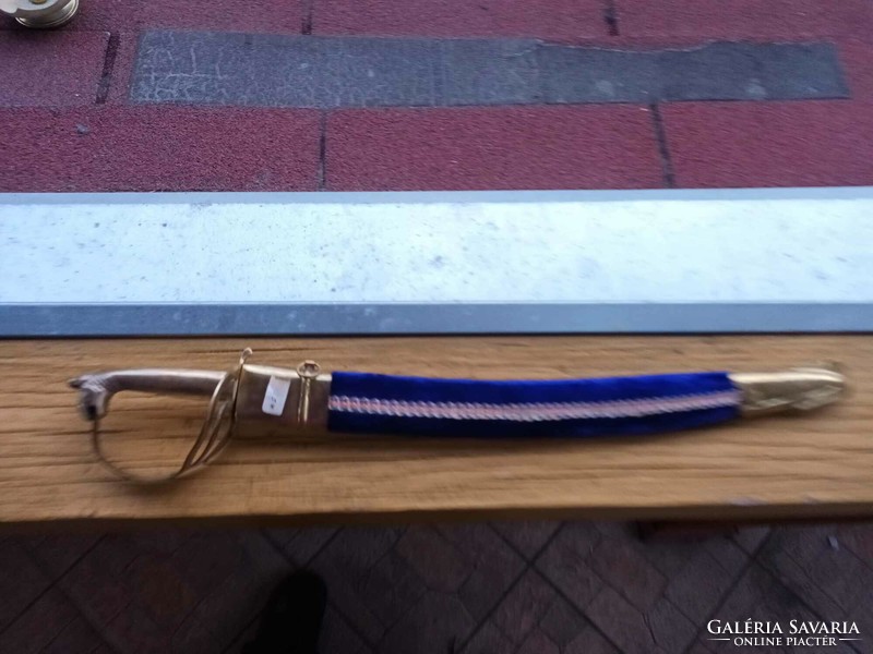 Old sword in sheath with copper hilt