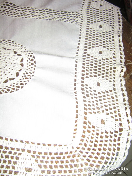 Elegant tablecloth with a beautiful hand-crocheted edge and crochet insert