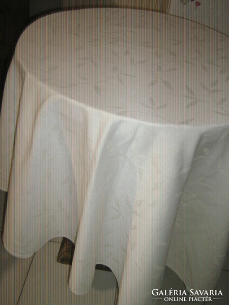 Beautiful buttery leaf pattern on round damask tablecloth
