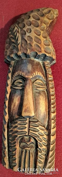 Carved outlaw head