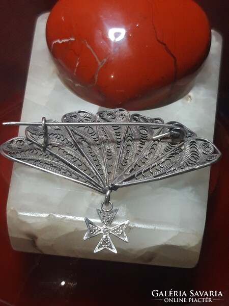 Old filigree fan-shaped silver brooch with imperial cross