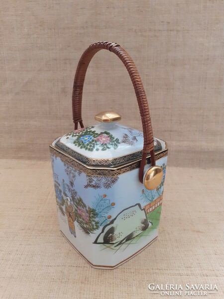Old Chinese hand-painted porcelain tea herb holder with a bamboo handle and a small marked lemon squeezer
