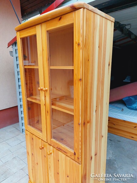 A 2-door claudia pine display case for sale. Rs furniture furniture in nice, new condition.