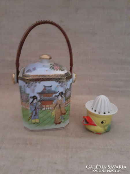 Old Chinese hand-painted porcelain tea herb holder with a bamboo handle and a small marked lemon squeezer