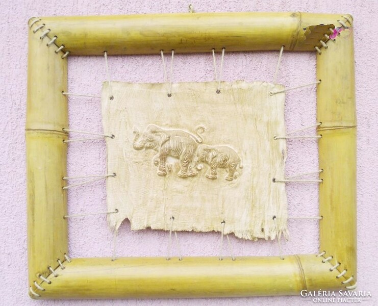 African tribal leather decoration. Elephant bas-relief with bamboo frame.