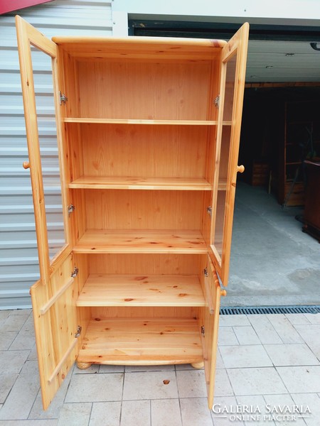 A 2-door claudia pine display case for sale. Rs furniture furniture in nice, new condition.