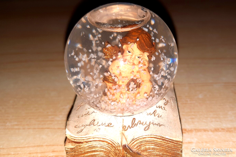 Old glass sphere with an angel