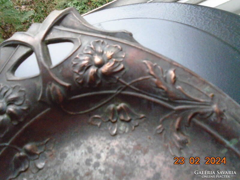 Art Nouveau bronzed hand-made metal wall decoration crumb tray decorated with a repoussé flower motif