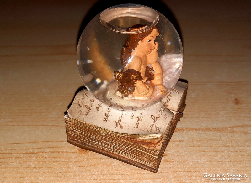 Old glass sphere with an angel