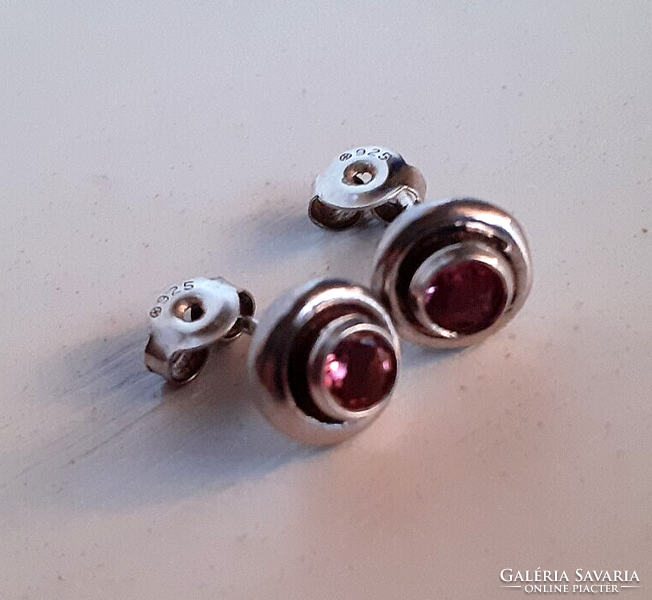 Marked 925 sterling silver stud earrings studded with a polished pink zirconia stone