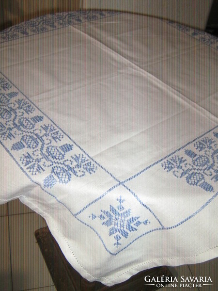 Beautiful acorn tablecloth embroidered with blue cross stitches