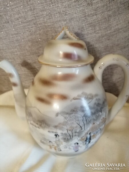 A jug with an oriental scene is beautiful