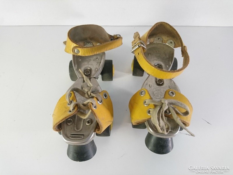 Old retro adjustable size roller skates with leather straps - tuv rheinland germany 1980s