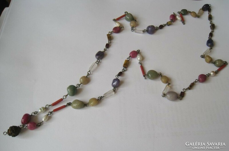 Long metal necklace with minerals and precious stones