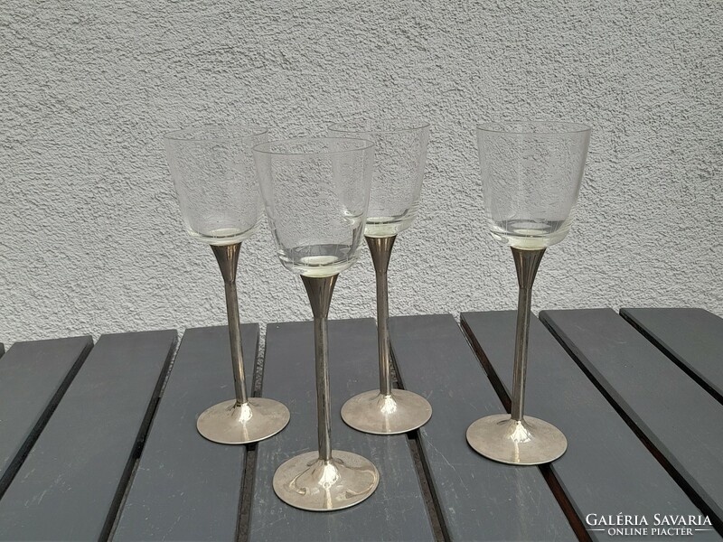 Engraved glasses with metal bases in one