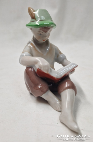 Old hand-painted drasche porcelain reading boy in perfect condition 9 cm.