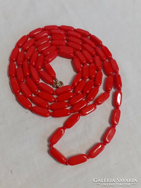Retro necklace made of long red porcelain beads in good condition
