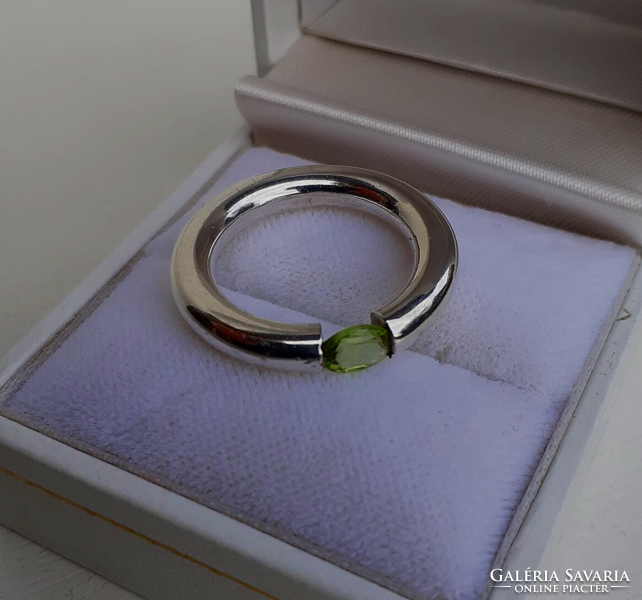 Nice condition solid silver wedding ring set with a polished pale green cubic zirconia stone