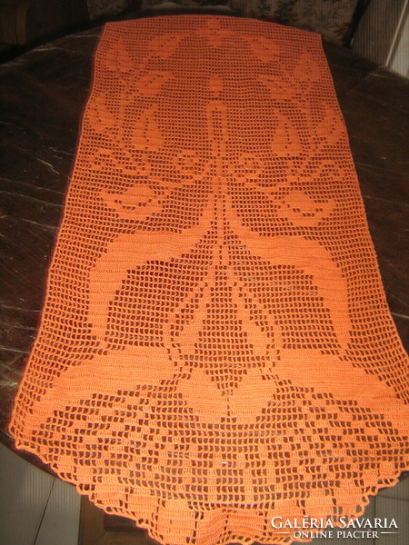 Beautiful, hand-crocheted orange-colored floral tablecloth with candles and leaves, large runner