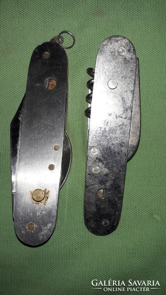 Two Swiss multi-functional steel knives as shown in the pictures