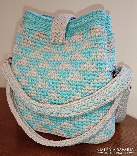 A crocheted bag is available