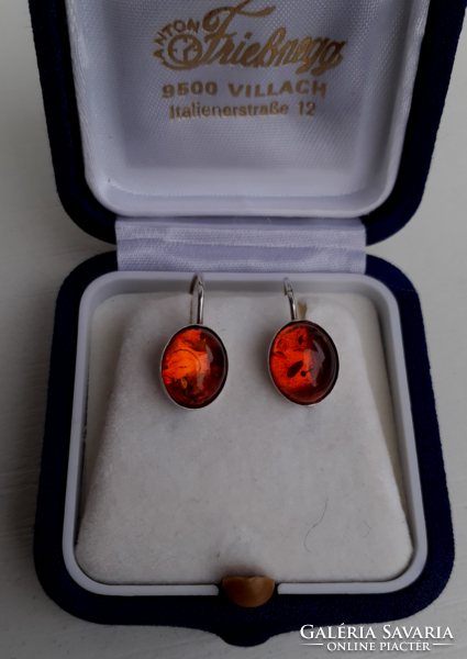 In good condition marked sterling silver hook earrings studded with real amber stones