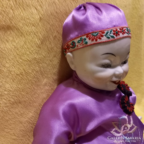 Beautiful, smiling, Chinese porcelain doll. Vintage doll.