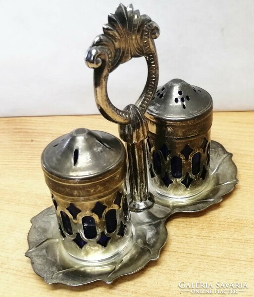 Antique silverware rarity. Tabletop silver-plated salt and pepper shaker with a pair of holders