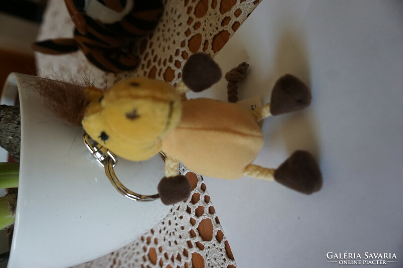 Plush mascot animal with key ring for sale.