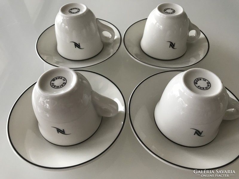 Nespresso cups made of white porcelain with a black border