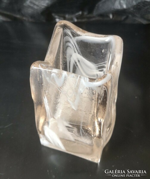 Its heavy, square glass vase is 11.5 cm high