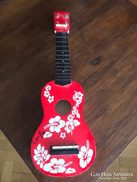 Gyerek játék gitár. Piros színben. Mérete: 51x16 cm