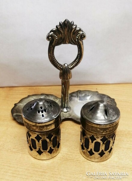 Antique silverware rarity. Tabletop silver-plated salt and pepper shaker with a pair of holders