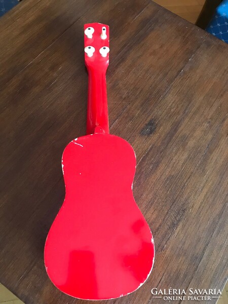 Children's toy guitar. In red. Size: 51x16 cm