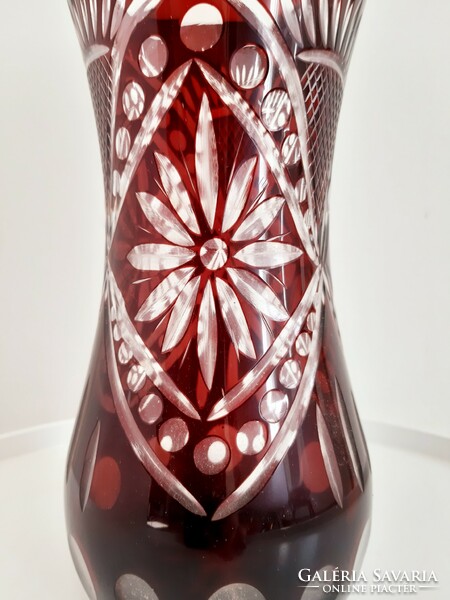 Old burgundy polished glass vase