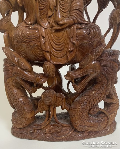 Elaborately carved wooden Buddha statue