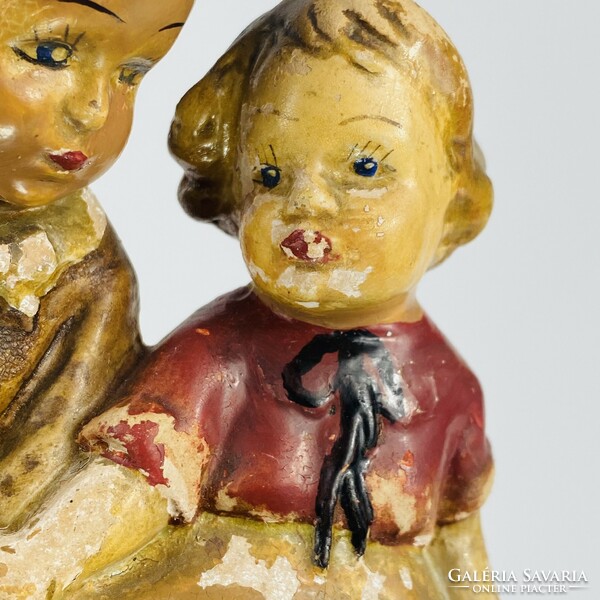 Dr. Rank ceramic pottery - children sitting on a bench