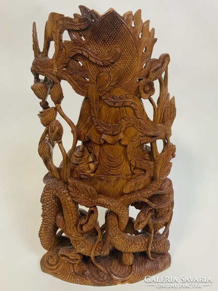 Elaborately carved wooden Buddha statue