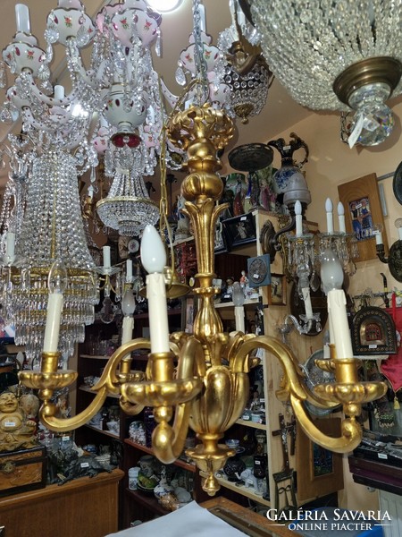 Old restored gilded wooden chandelier