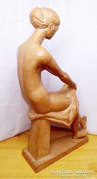 The work of a contemporary artist. László Deák: undressing nude.