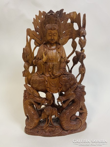 Elaborately carved wooden Buddha statue