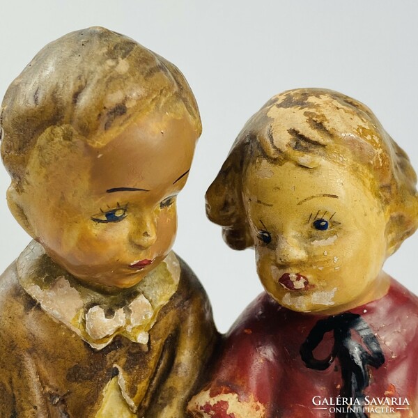 Dr. Rank ceramic pottery - children sitting on a bench