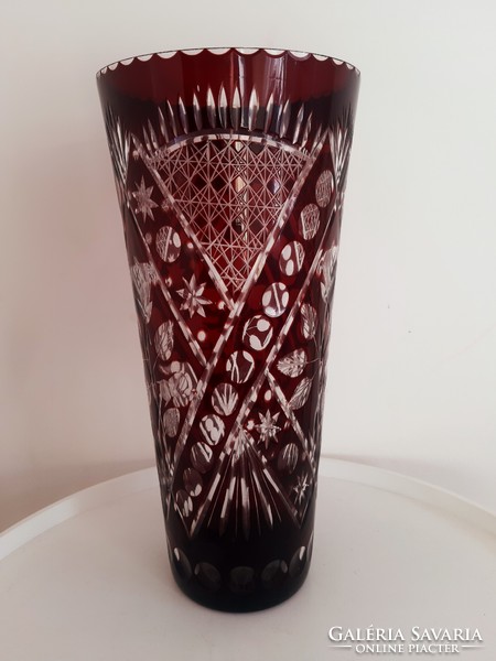 Old burgundy polished glass vase
