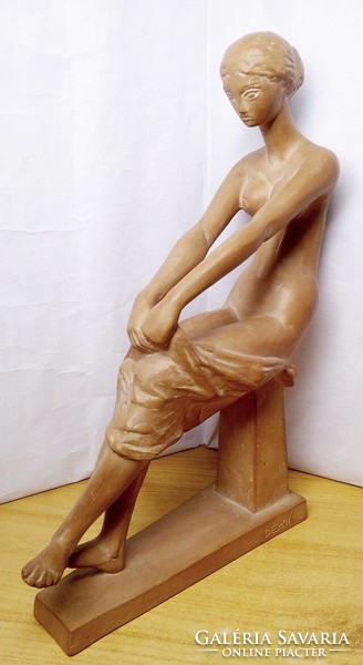 The work of a contemporary artist. László Deák: undressing nude.
